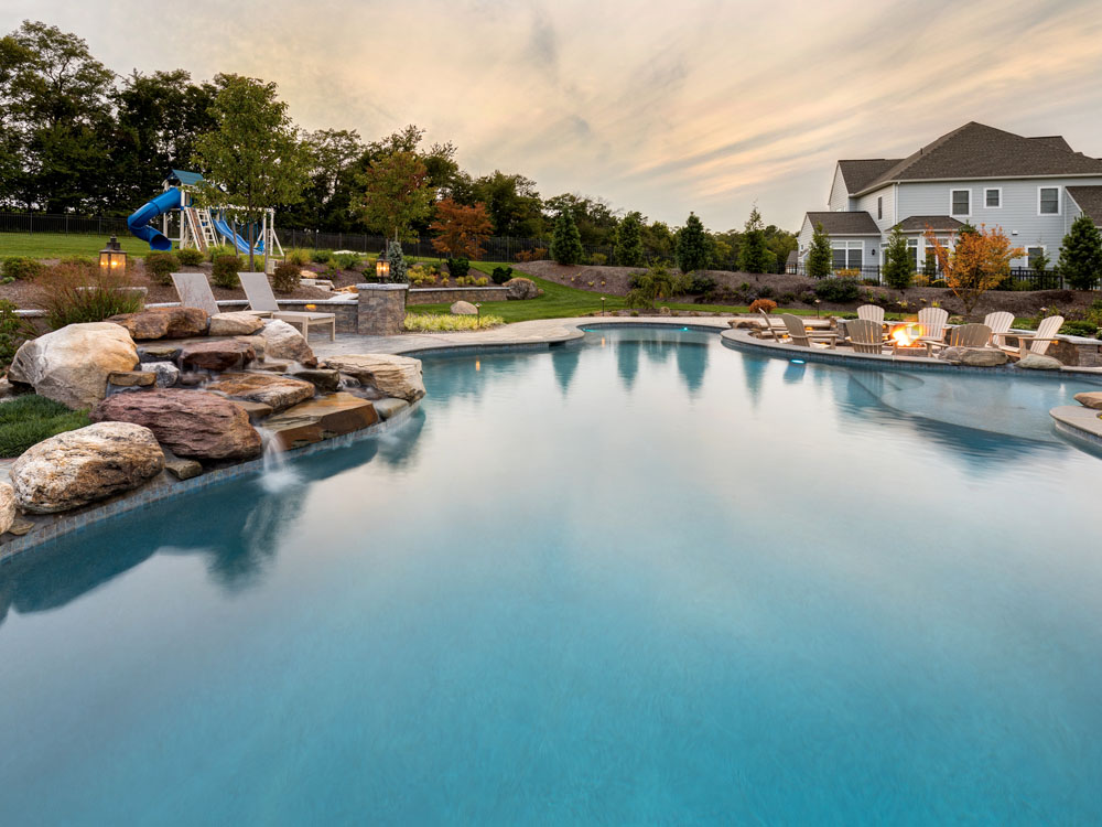 Huge luxury backyard pool with waterfall