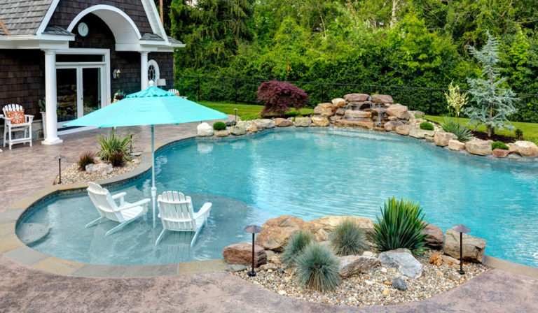 Benefits of Having a Sun Deck or Tanning Ledge in Your Gunite Swimming Pool