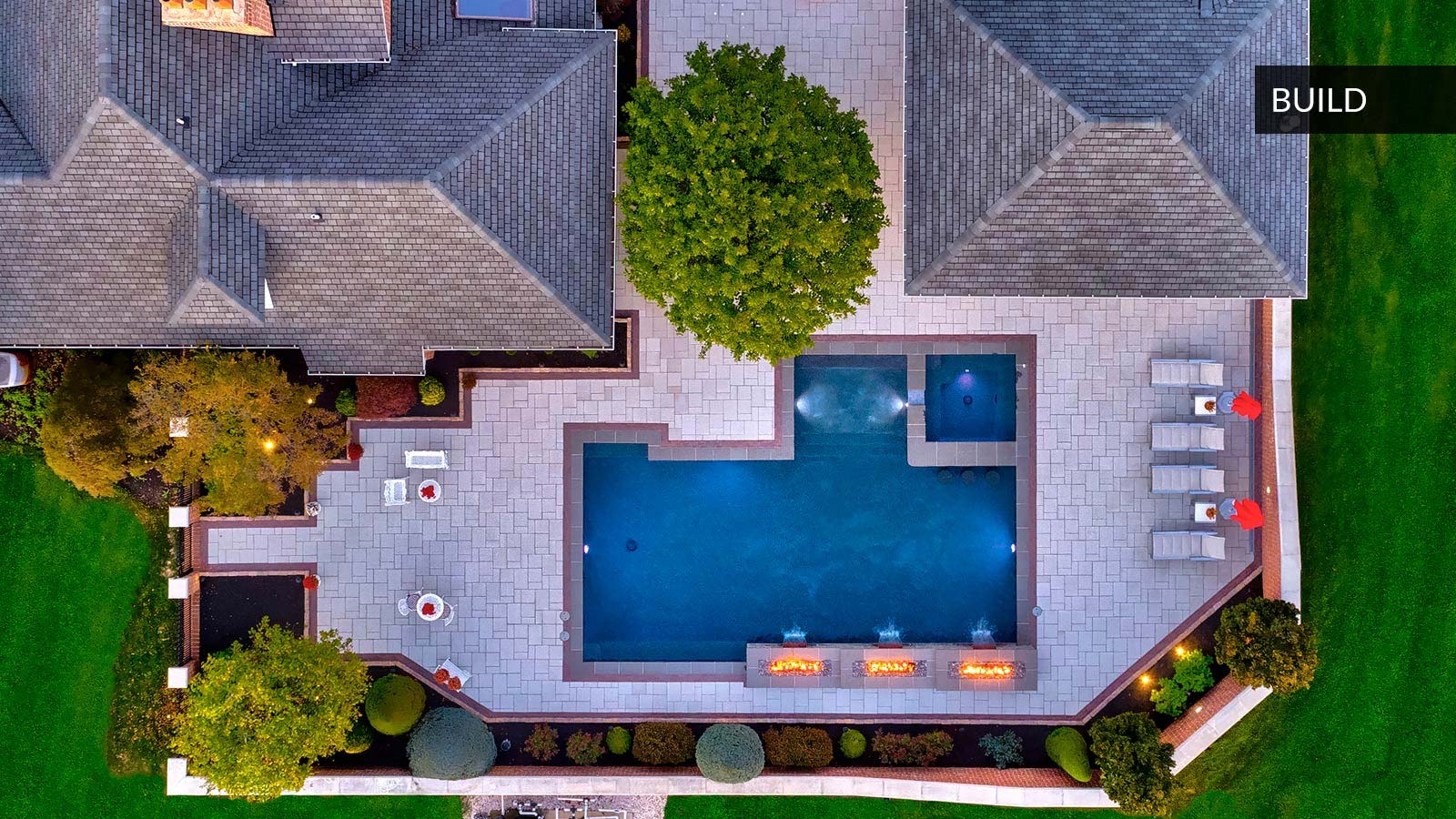Drone top down view of square backyard pool