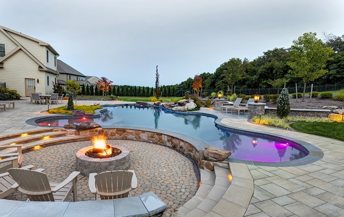 Fire pit next to luxury pool