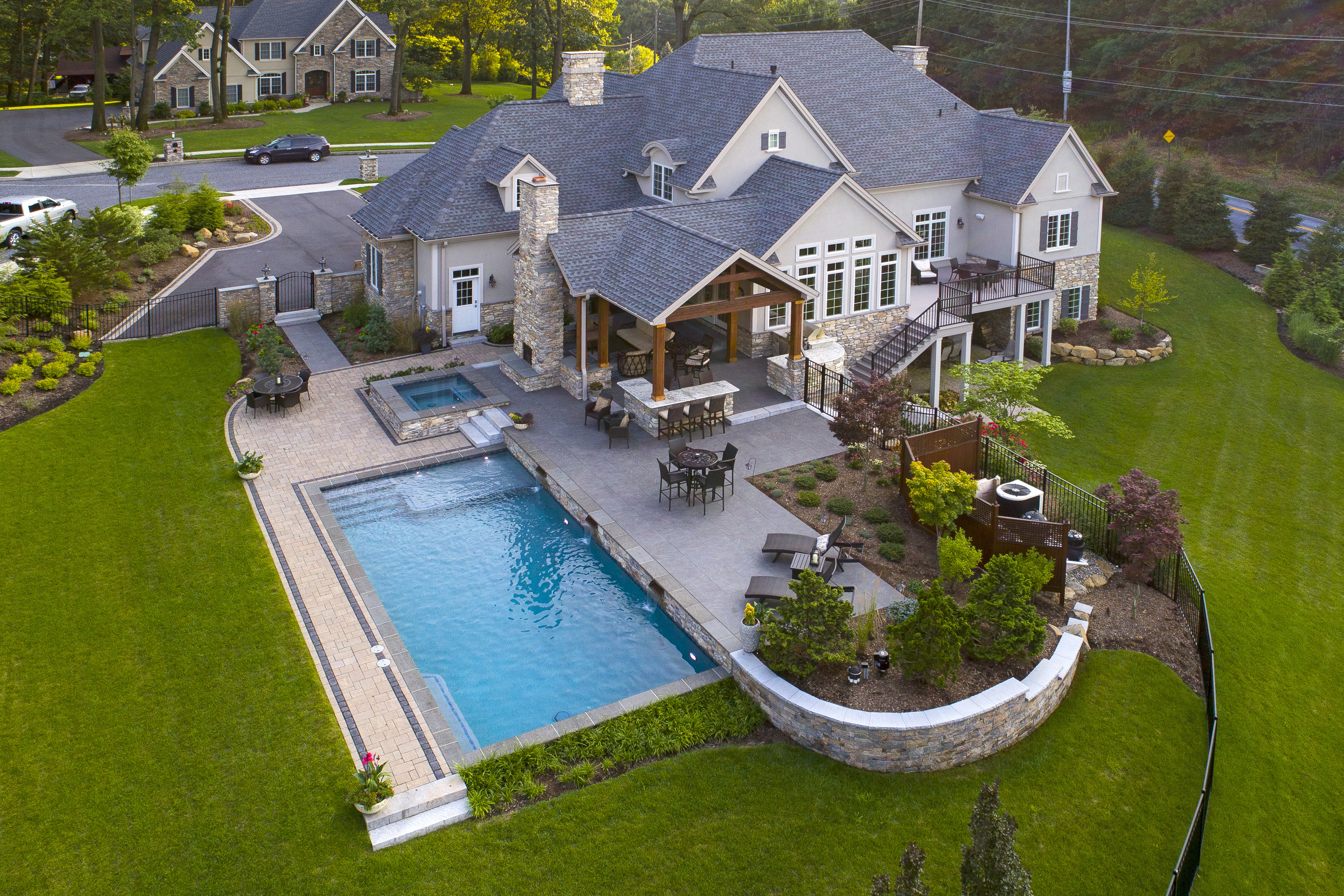 Drone shot of beautiful home with luxury pool