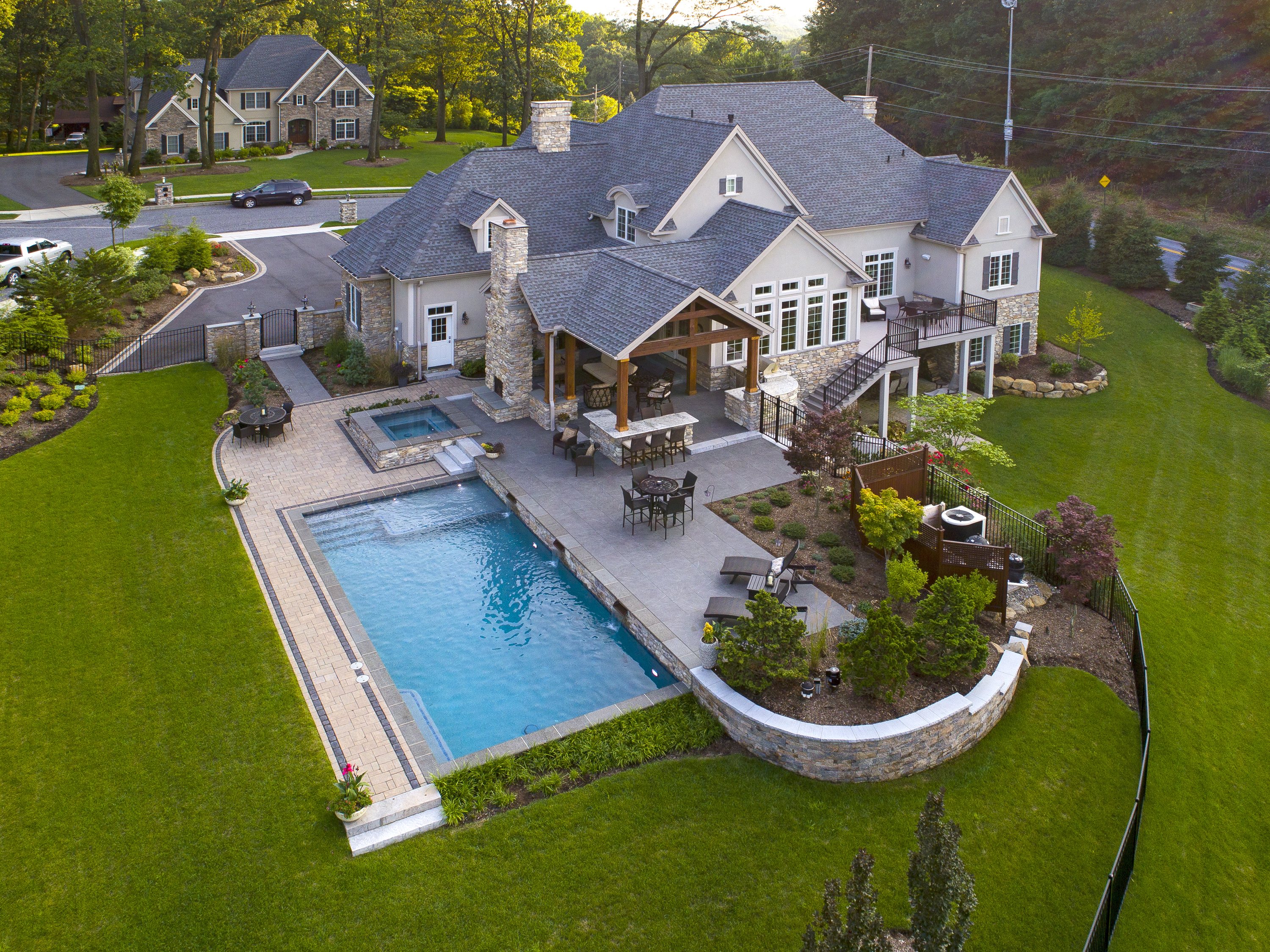 Drone shot of beautiful home with luxury pool